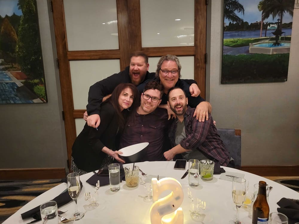 Happy customers share a photo with Sora technicians